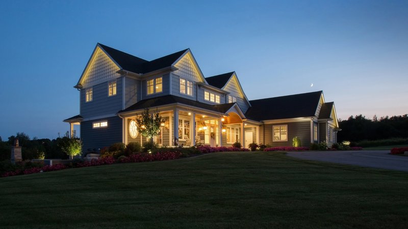 Custom Home Builders in Minocqua WI Create a Residential Library With Paneling and Built-In Shelving